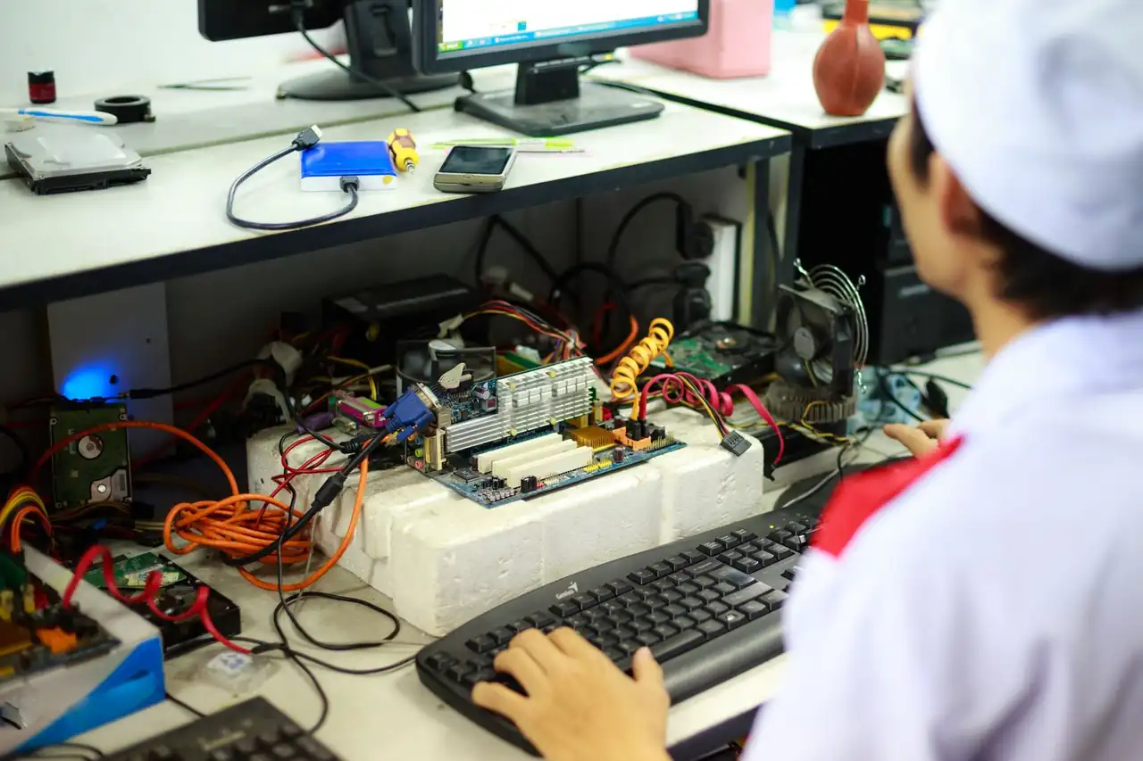 Professional technician working at a secure data recovery workstation