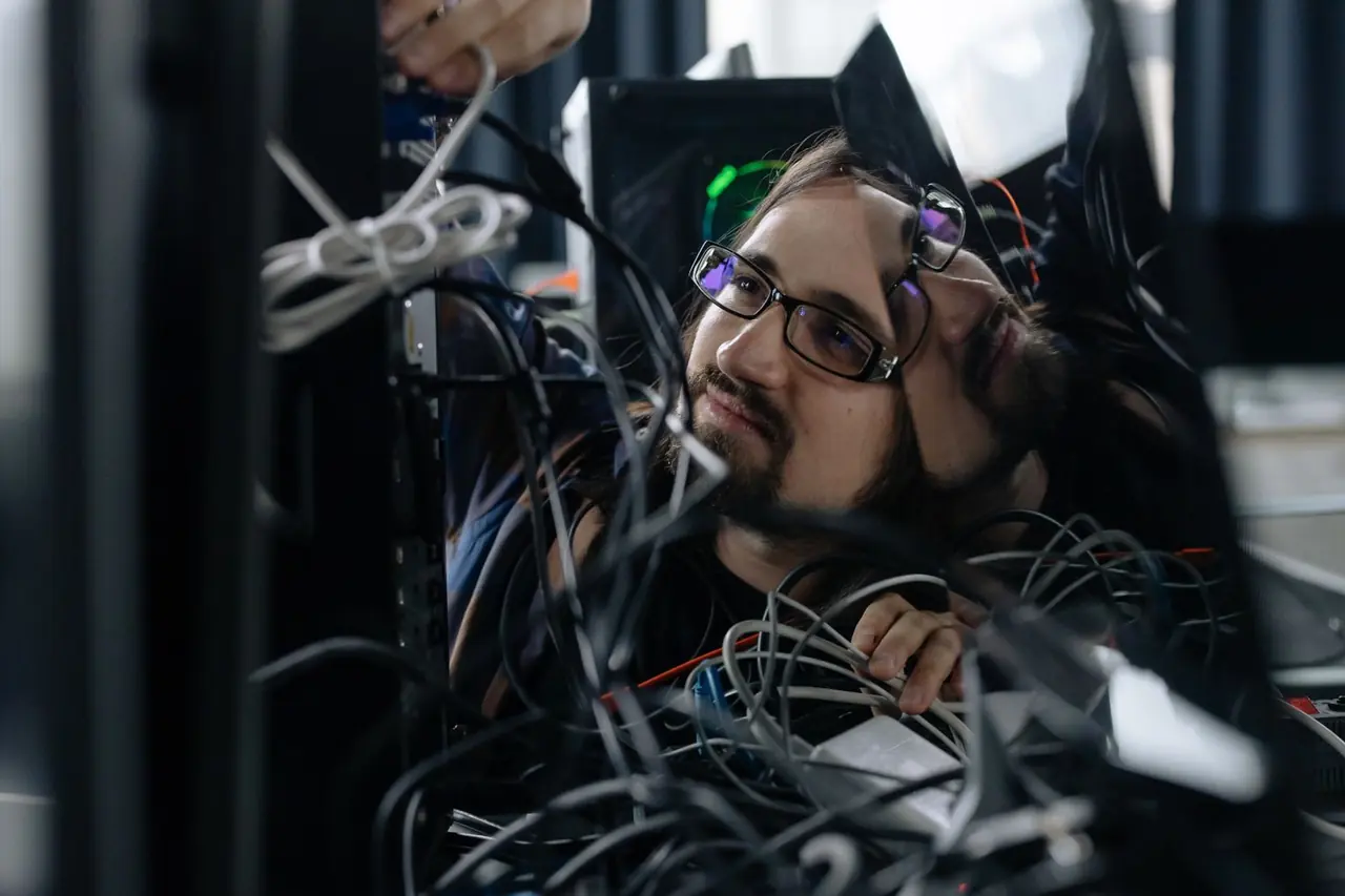 Technician configuring office peripherals